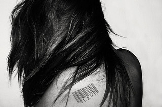 woman with slave barcode on shoulder